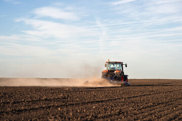 Poster - Tractor preparing the land for a new crop planting