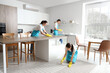 © Pixel-Shot - Young janitors cleaning in kitchen