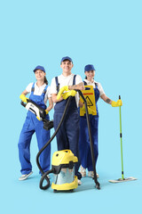 Sticker - Workers of cleaning service with supplies on blue background