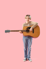 Sticker - Cute little boy playing guitar on pink background