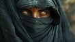 Only the man's eyes are visible through the black chador covering his entire body, giving him an evil-looking appearance.
