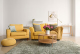 Fototapeta Panele - Interior of light living room with sofa, armchair and tulips on table