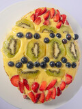 Fototapeta Uliczki - A fruit cake with the appearance of an Easter egg
