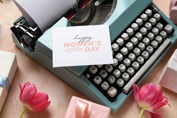 Wall Mural - Festive postcard on typewriter for Women's Day, gift boxes and tulips on pink background