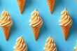 Pattern of ice cream cones arranged on blue background, top view, sweet summer treats in colorful cones