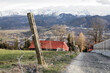 ZAKOPANE, POLAND - MARCH 29, 2024: Rural road through the fields leading to Zakopane, Poland.
