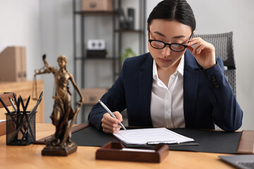 Canvas Print - Notary signing document at table in office