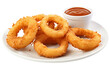 © FMSTUDIO - A white plate holds golden-brown onion rings beside a cup of ketchup
