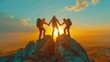 Hikers joining hands on a mountain summit at sunrise.