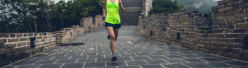 Wall Mural - runner athlete running on chinese great wall
