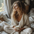 woman with cup of coffee relaxing at home