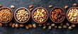 A row of bowls filled with different types of nuts, including pecans and pistachios, set against a plain background.
