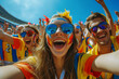 Joyful fans with vibrant face paint taking a selfie at a sports event, embodying team spirit and fun