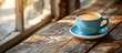 An aromatic cup of freshly brewed coffee sits atop a rustic wooden table, steaming gently into the air.