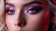   A tight shot of a woman's face wearing purple eyshadow and pink-purple makeup