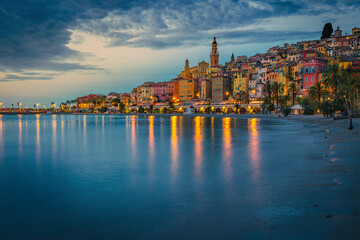 Wall Mural - Old colorful mediterranean seaside buildings in Menton at dawn, France