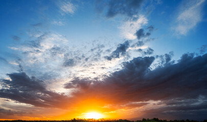 Wall Mural - Sunset in with dramatic storm clouds.