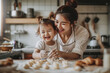Portrait of a joyful Asian mother with her laughing toddler while baking in the kitchen, sharing a bonding moment