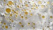 This is an image showing water droplets and bubbles with golden hues on a reflective surface