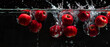 Bright red apples dropping into a dark water tank, creating a dramatic splash