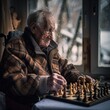 An elderly man is playing chess in a room with a window