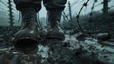 Boots step through heavy mud, flanked by barbed wire, in a 3D scene with dim, moody lighting