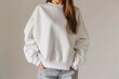 Mockup. Young woman wearing blank basic plain white oversized crewneck sweatshirt