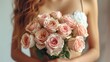  A woman holds a bouquet of pink roses while wearing a strapless dress in a close-up