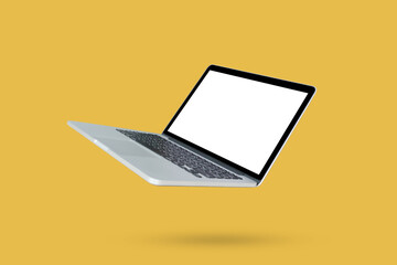 Wall Mural - Laptop with blank screen isolated on yellow background