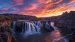 The sky lights up at sunset over shoshone falls in Idaho shoshone falls is considered