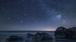 A breathtaking nightscape showing a dazzling starry sky over a calm ocean, with rocks in the foreground and galaxy visible