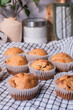 The homemade banana muffins lay in the kitchen towels in the kitchen for baking concept and cooking.