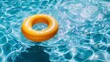 Yellow inflatable swimming ring in a sparkling pool. Summertime recreation and relaxation concept