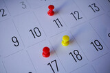 Fototapeta Dmuchawce - Drawing pin on the calendar, days of the month