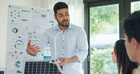 Group diverse Asia businesspeople talk ESG strategies risk management workshop, SDGs report, global warming, green finance and investment and net zero waste lifestyles in boardroom training building.