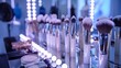 Backstage makeup station with illuminated mirror, professional brushes and white gown