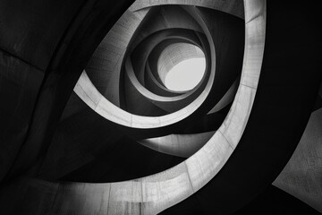 Poster - A black and white photo of a spiral staircase, suitable for architectural designs