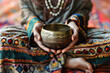 a person's hands holding a meditation bowl, ready to produce calming sounds to aid in mindfulness and relaxation