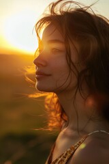 Poster - A woman with her eyes closed and her hair blowing in the wind. Suitable for beauty and relaxation concepts