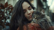 long-haired woman holding a cat