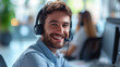A smiling call center with headphones