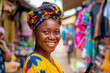 Portrait of smiling african woman using mobile phone at a local market
