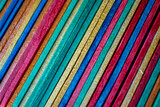 Fototapeta Dmuchawce - multi colored wooden craft sticks, colorful background