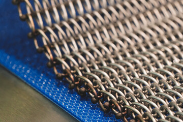 Aufkleber - A close up of a metal chain with many small links. The chain is silver and has a metallic look