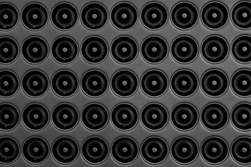 Aufkleber - A black background of many circles of various sizes. The circles are all different sizes and are arranged in a pattern. The photo has a somewhat abstract and minimalist feel to it