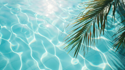 Poster - A palm tree branches above the clear blue calm water of the pool sparkling in the sun’s rays. Vacation happiness and tranquility concept background.