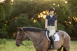 Equestrian portraits on a roan bay horse riding in English Tack hunter jumper eventing