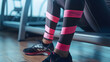 Shin Support with Pink Therapeutic Kinesiology Tapes on Athlete Legs
