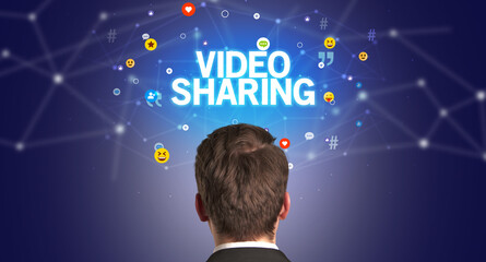 Poster - Rear view of a businessman, social media concept