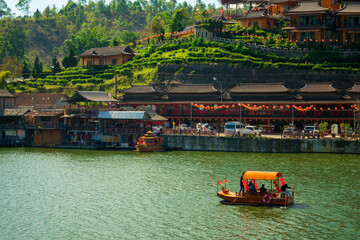 Beautiful landscape Tourists sit on a boat in the lake at Ban Rak Thai, Unseen Thailand At Ban Rak Thai, Mae Hong Son Province